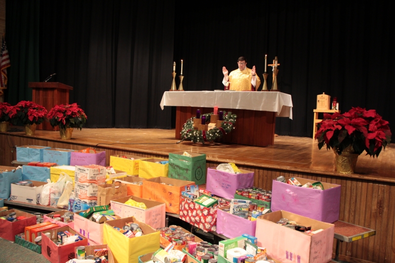 Regis students give back at annual Gold Mass